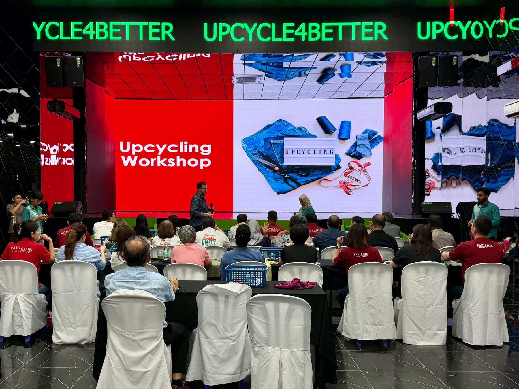 Upcycle4Better upcycling workshop presentation with participants in the audience